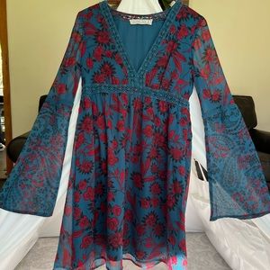 Jewel toned floral bell sleeve dress with lace detail